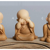 Tượng chú tiểu áo nâu dễ thương