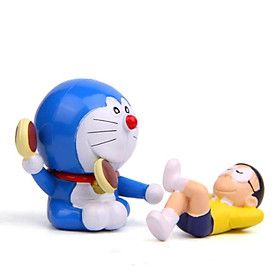 Mô hình Nobita lười biếng nằm ngủ và mèo Doraemon ăn bánh rán quen thuộc