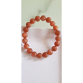 Vòng tay nữ đá mặt trời Sunstone Size 10li hay 10mm đẹp quyến rũ sang trọng đem lại sự tự tin Nổi bật bởi tông màu hồng cam nhẹ nhàng lấp lánh của đá mặt trời Sunstone tượng trưng cho thần mặt trời đẹp Đá Sunstone phù hợp với người mệnh Thổ và mệnh Hỏa ạ