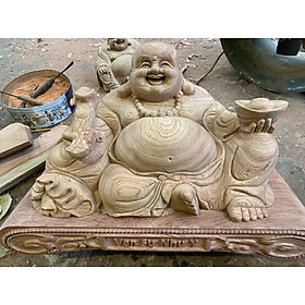 Tượng phật di lặc tay nâng thỏi vàng bằng gỗ hương đá kt ngang mặt 60cm