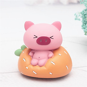 Hộp nhạc heo hồng ngồi ghế sopha
