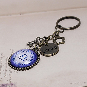 Móc khóa 12 cung hoàng đạo Zodiac tông tím trắng 06646-M1