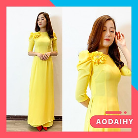 Áo dài thiết kế tay bồng ngực gắn hoa màu vàng chanh
