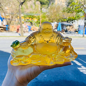 Tượng Phật Di lặc cầm thỏi vàng ngồi tựa bao tiền đá lưu ly vàng đặt bàn làm việc, xe ôtô