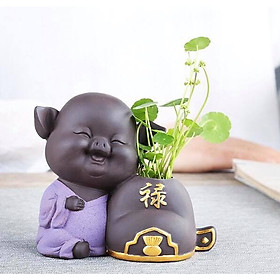 Tượng heo trồng cây chữ Lộc