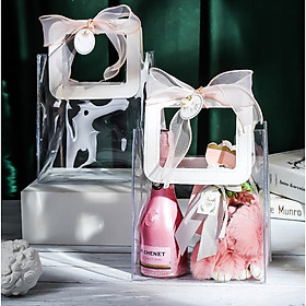 Túi đựng quà trong suốt quai da kèm nơ, giấy rơm độc đáo