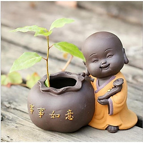 Tượng chú tiểu trồng cây viên mãn an lạc