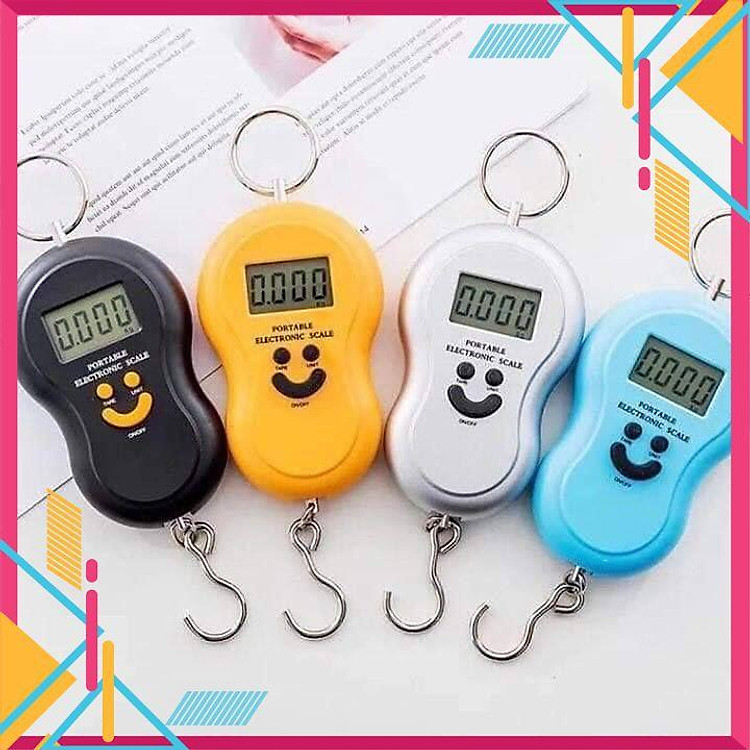 CÂN ĐIỆN TỬ CẦM TAYCÂN MINI ĐIỆN TỬ CẦM TAY HÌNH MẶT CƯỜI SỬ DỤNG CÂN HÀNG HOẶC ĐI CHỢ TIỆN LỢI