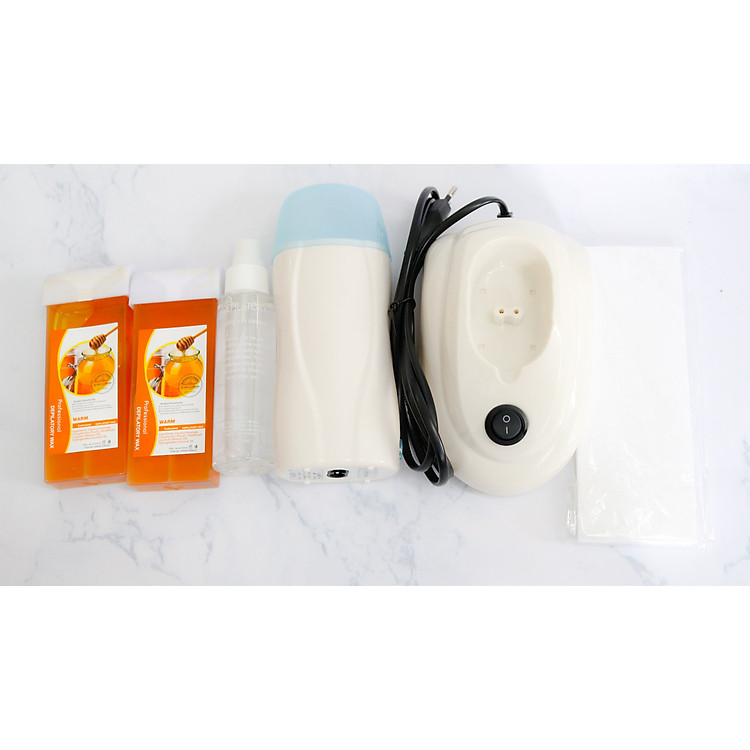 Máy Wax Lông 6in1 Gồm: 1 Máy Wax Con Lăn + 1 Máy Sạc + 2 Sáp Wax Mật Ong + 1 Gói Giấy Wax Lông + 1 Chai Nước Vệ Sinh Vùng Da Sau Wax Lông
