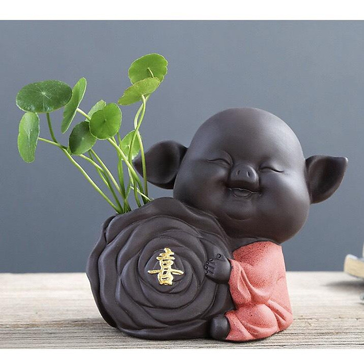 Tượng chú heo trồng cây chữ Hỷ