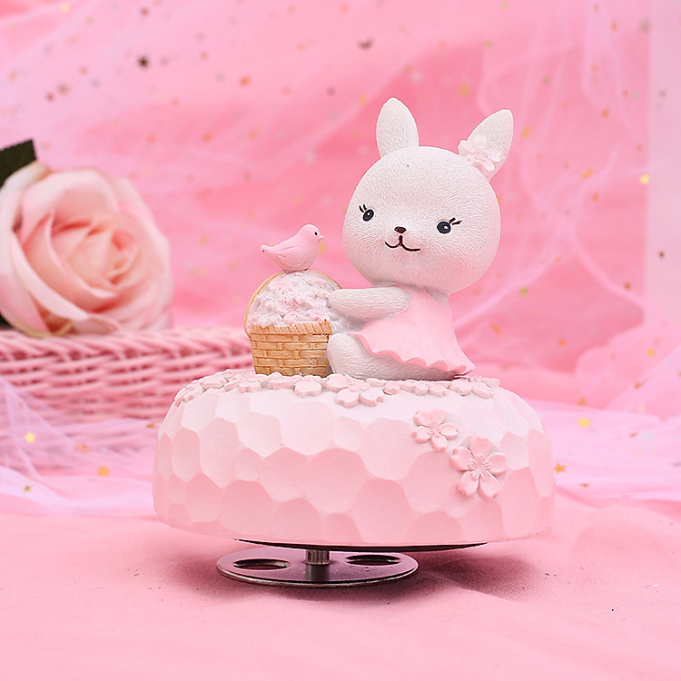 Hộp nhạc Sakura Thỏ váy hồng ôm giỏ hoa anh đào