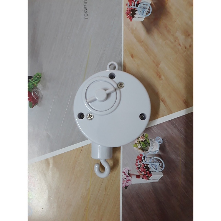 Hộp nhạc treo nôi vặn cót tự xoay tự phát nhạc