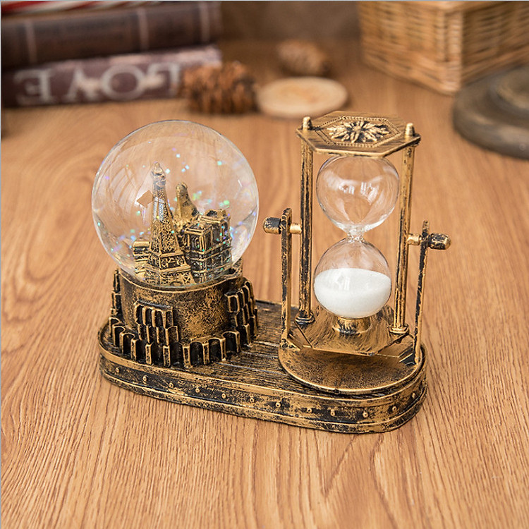 Quả cầu pha lê tuyết mô hình tháp phát sáng kèm đồng hồ cát trang trí - quà tặng độc đáo