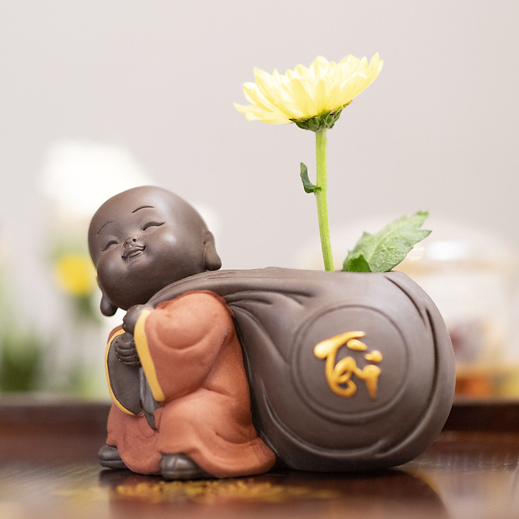 Tượng phong thủy chú tiểu trồng cây chữ Tài