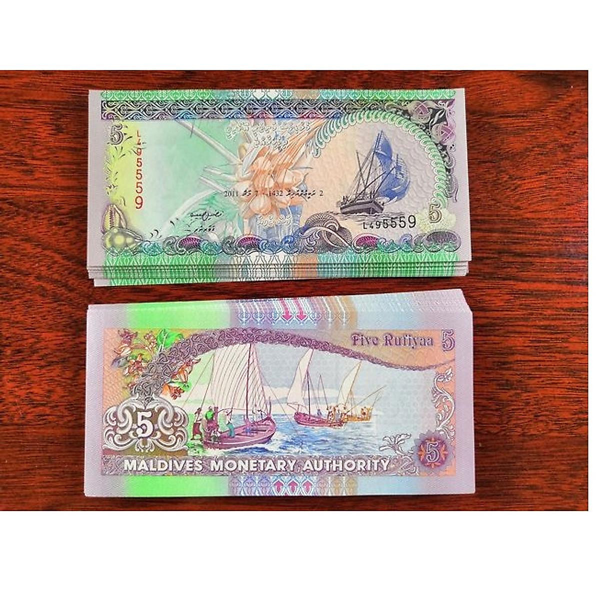 Tờ tiền Maldives: Khám phá tấm vé vào cổng thiên đường Maldives thông qua tờ tiền độc đáo và đầy màu sắc này. Hãy nhìn vào hình ảnh và cảm nhận sự tươi trẻ, phong cách và tinh tế từ đất nước Maldives đẹp như mơ.