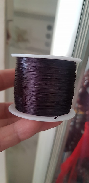 Cuộn Dây Thun CO GIÃN màu Đen xỏ vòng hạt chuỗi Dây này là dây thun chuyên xỏ vòng chuỗi màu Đen, có đủ màu Anh Chị đang đeo chuỗi muốn thay dây khác cho vòng thì đặt cuộn Thun chỉ này nhé