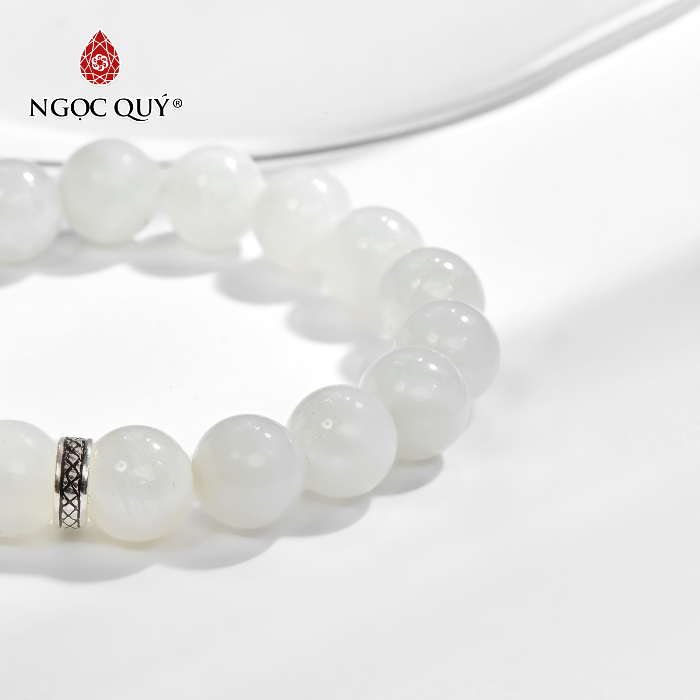 Vòng tay đá xà cừ trắng phối charm chữ vạn bạc Ngọc Quý Gemstones