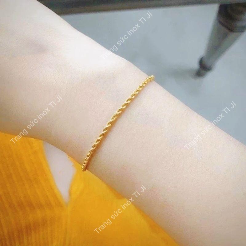 Lắc tay nữ inox mạ vàng kiểu xoắn khóa tròn đẹp không đen