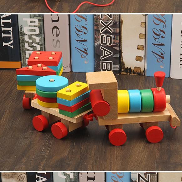 Đồ chơi tàu hỏa chở khối gỗ thả hình trụ an toàn cho bé