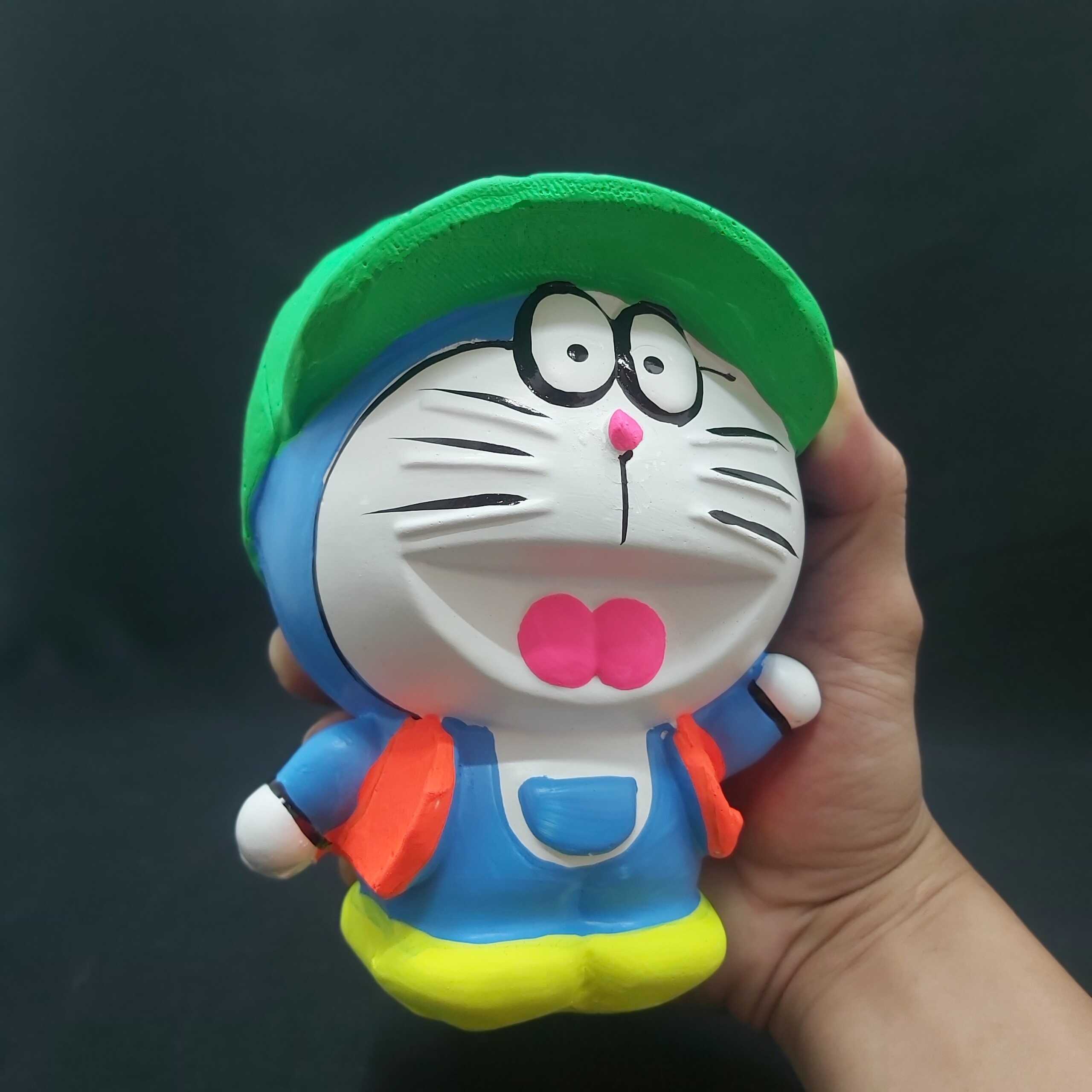 Ống heo tiết kiệm tiền nhỏ mẫu DORAEMON Đội Nón cực HOT – heo đất làm quà tặng sinh nhật được trẻ em yêu thích