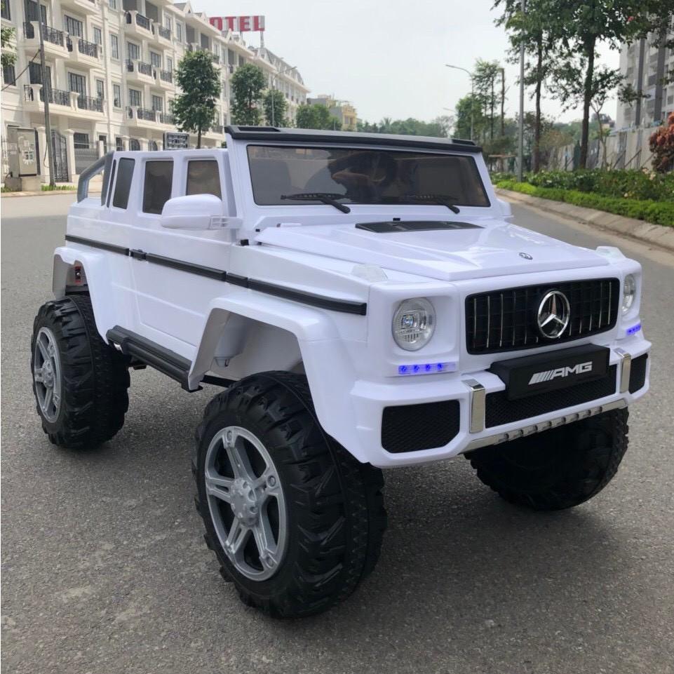 Ô tô xe điện trẻ em mẫu bán tải cho bé MERCEDES G650 cao cấp, 4 động cơ ắc qui lớn 12V7AH (Đỏ-Trắng) DH STORE