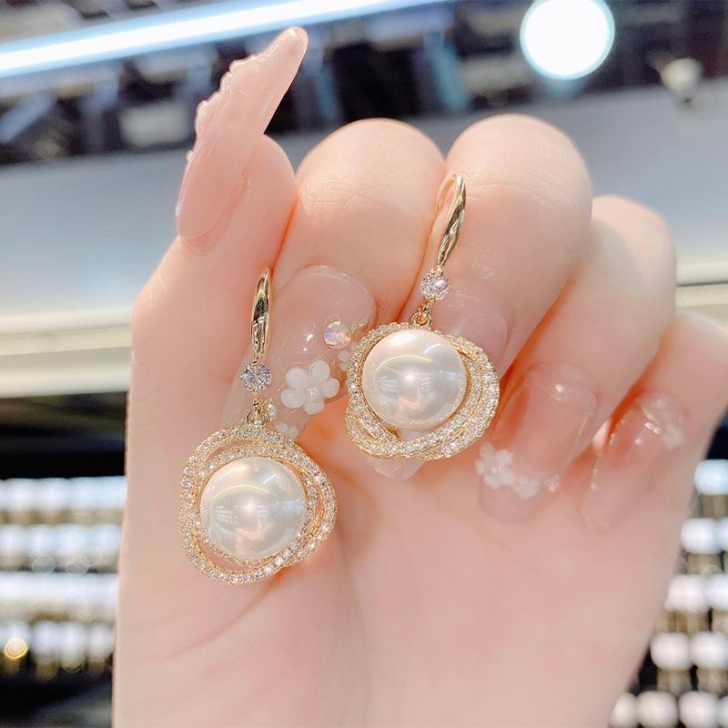 Khuyên tai hột tròn uốn lượn hình hoa