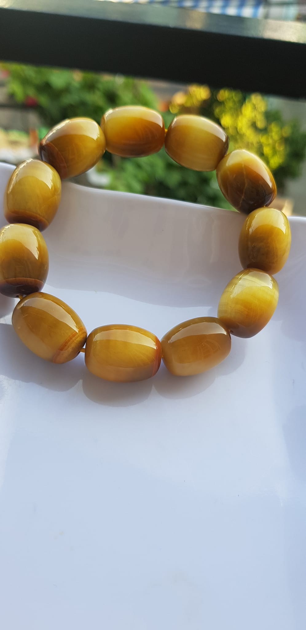 Vòng Tay Phong Thủy Nam Mệnh Thổ Kim Thủy Mới Đẹp Hạt Lu Thống Mới Vàng Nâu bóng đẹp Chất liệu đá mắt hổ tự nhiên vàng nâu bóng đẹp ạ Size hạt 14mm x dài 19mm ạ