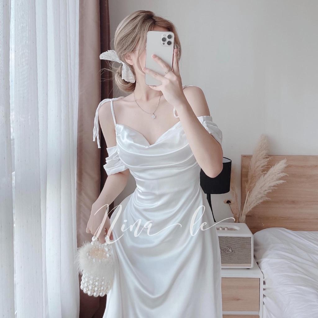 Đầm váy dự tiệc hai dây trễ vai xếp ly ngực màu trắng tinh khôi giúp nàng nổi bật.