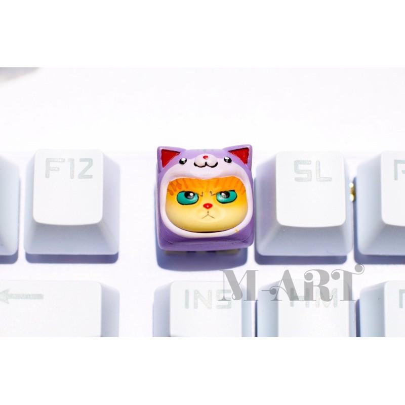 Keycaps mèo dễ thương và chiếc mũ màu tím