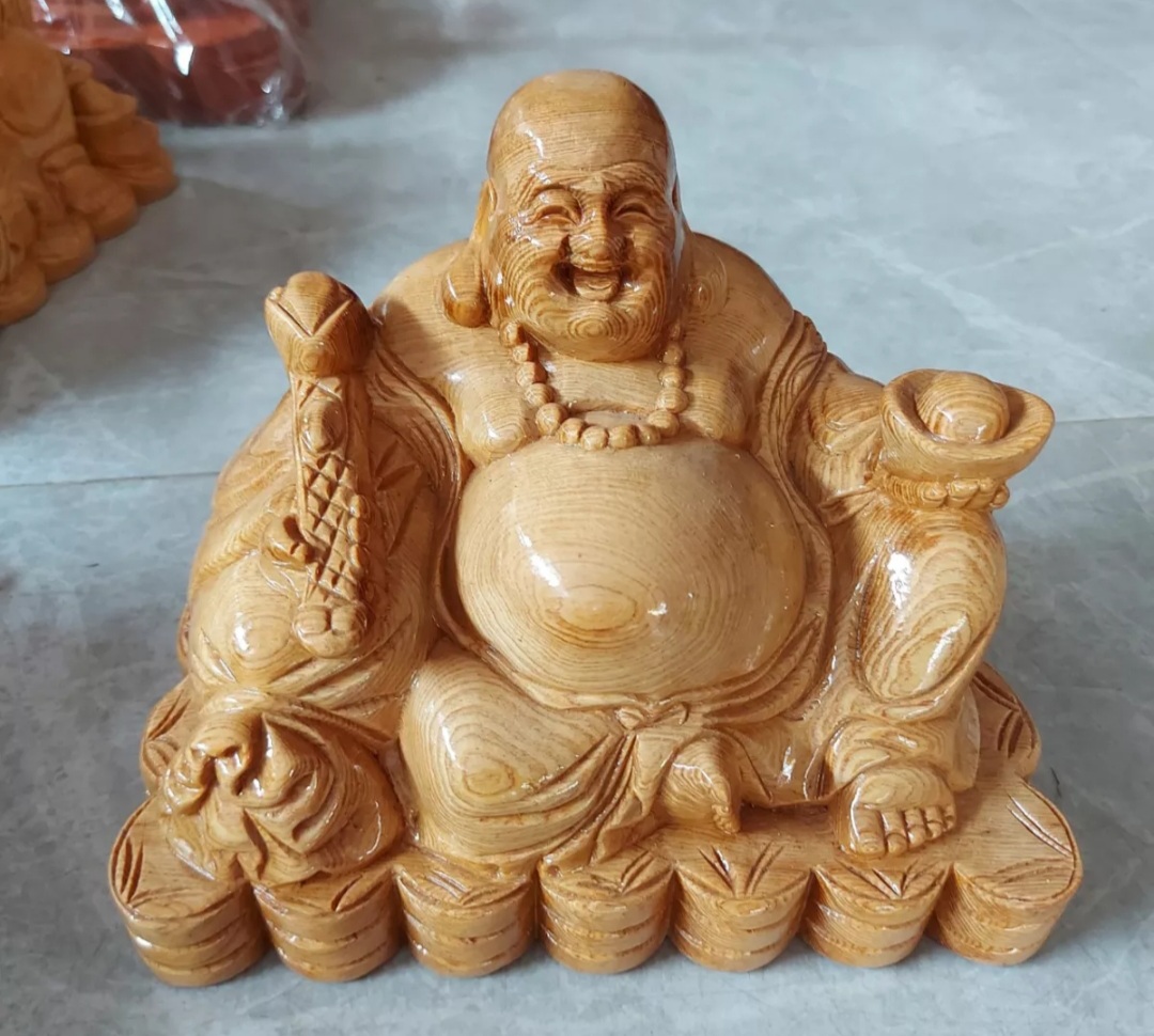 Tượng phật di lặc ngồi gỗ pomu ngang 25cm