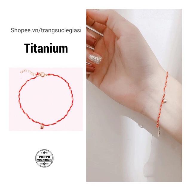 Vòng tay titan dây đỏ chuông nhỏ