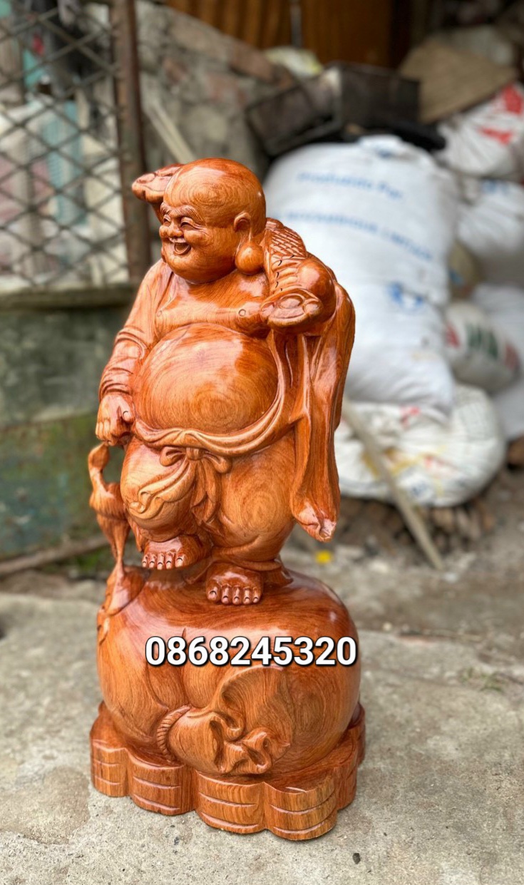 Tượng phật di lặc dắt cò bằng gỗ hương đá kt cao 60×26×24cm