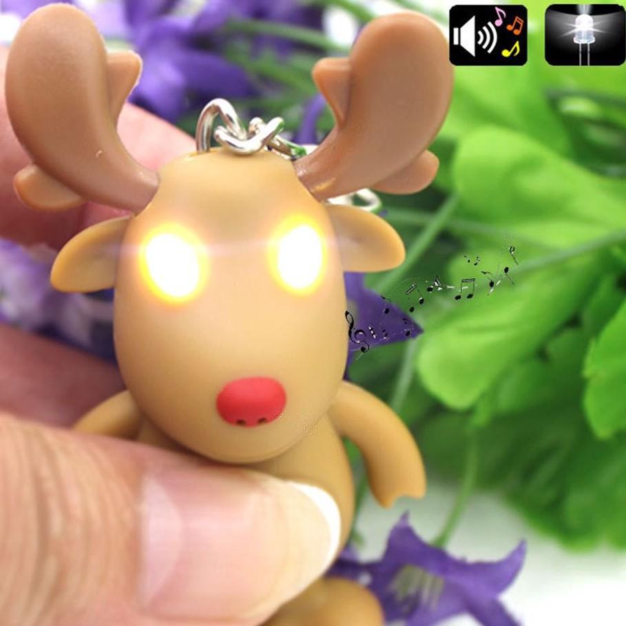 Móc khóa hình con tuần lộc giáng sinh phát sáng đèn Led sở hữu đèn sở hữu âm thanh