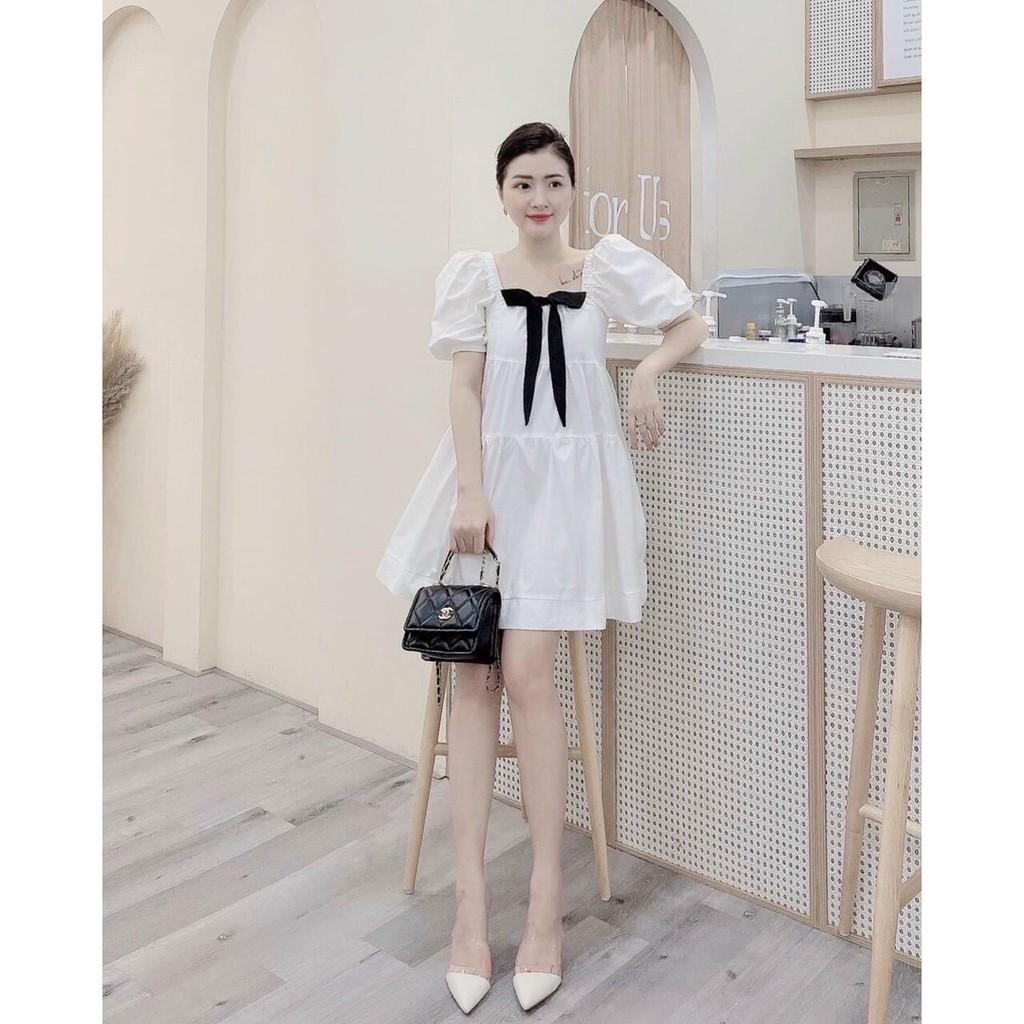 Đầm babydoll trắng cổ vuông tay phồng kèm nơ ngực