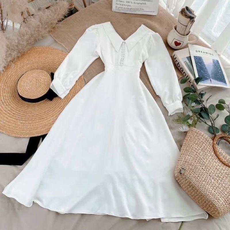 Đầm trắng tay dài nút bọc