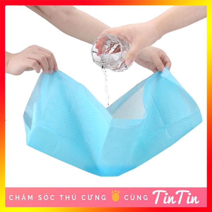 Tã lót cho chó mèo đi vệ sinh vào khay, chuồng bằng giấy siêu thấm hút