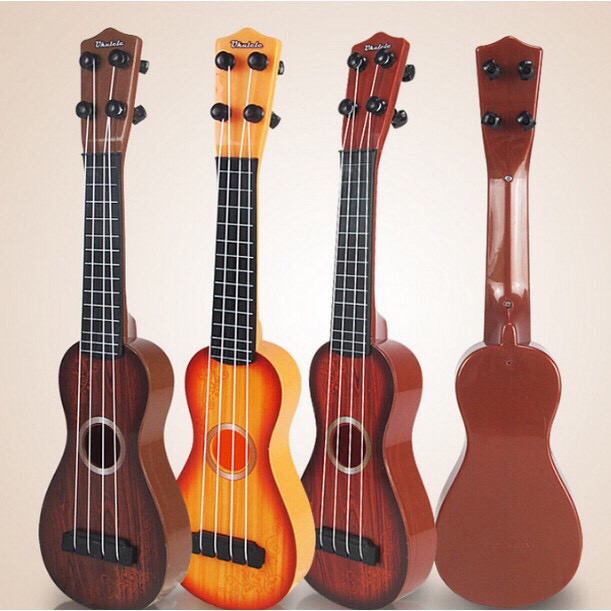 Đàn Ukulele Nhựa Cho Bé Đàn Ghi Ta Mini Nhiều Mẫu Dễ Thương Cho Bé Màu Vân Gỗ Giao Hoạ Tiết Ngẫu Nhiên