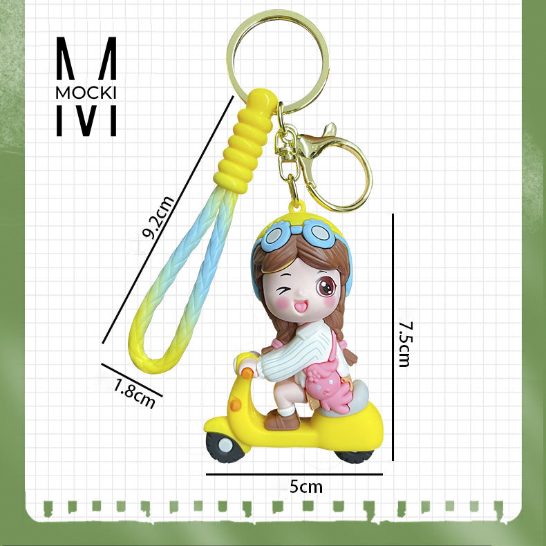 Móc khóa Cô gái chàng trai chạy xe máy