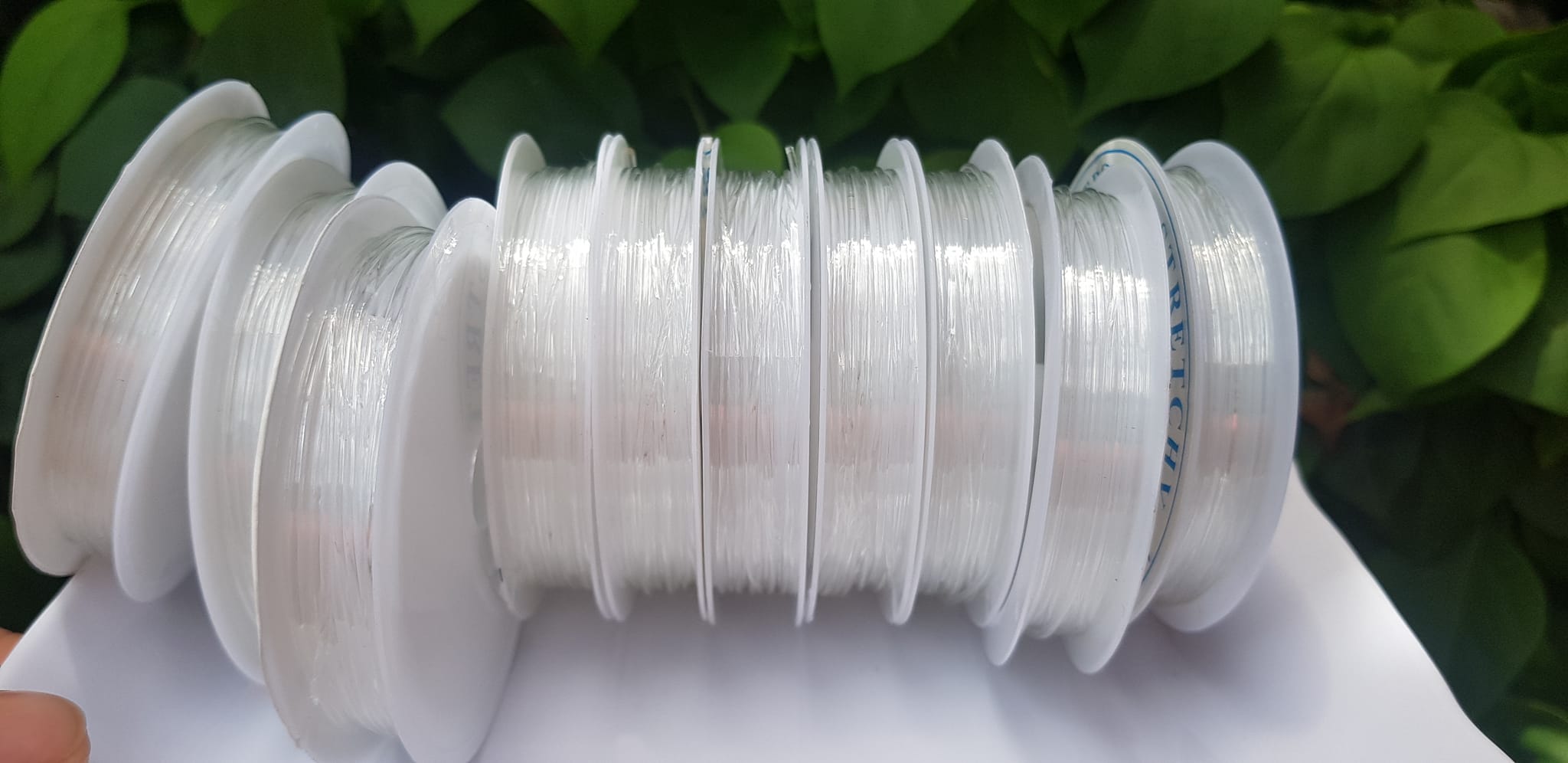 Khoanh tròn cuộn Thun Dẻo Màu trắng nhỏ chuyên xỏ tất cả vòng đeo tay Thun dẻo trắng xỏ vòng tay nam nữ ạ