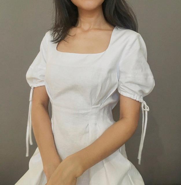 Đầm trắng cổ chữ U tay nơ