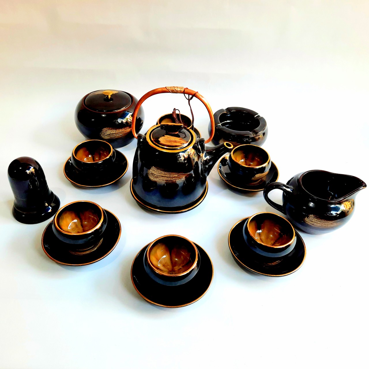 Bộ ấm chén Bát Tràng cao cấp “hoa trong lòng gốm” men hoả biến hổ phách viền vàng 24k