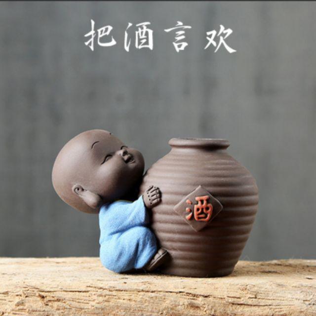 Tượng chú tiểu ôm lu- tượng trồng cây