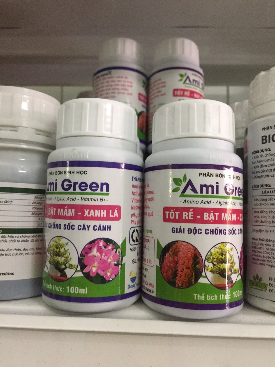 Phân bón sinh học AMIGREEN Kích rễ, kích mầm, giải độc cây - Chai 100ml - Ami Green Tốt rễ, bật mầm, xanh lá cây trồng