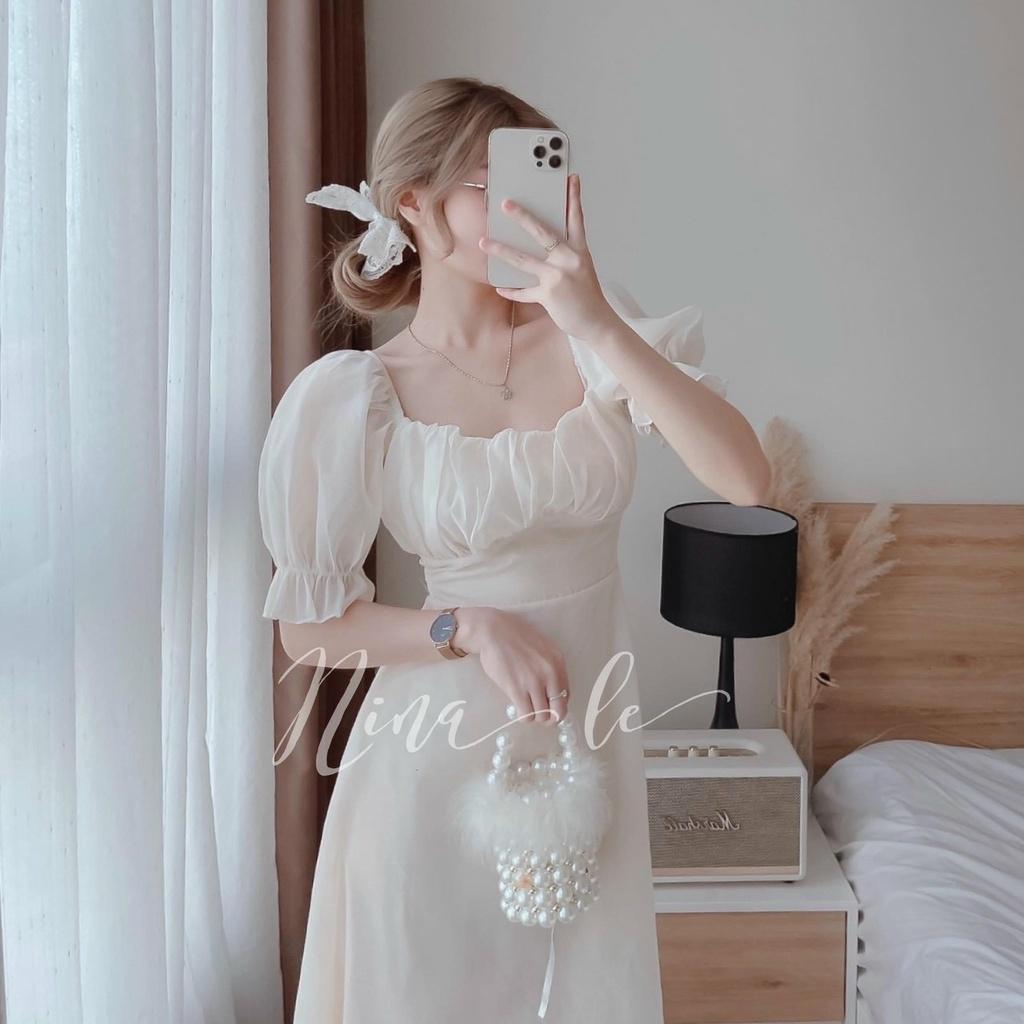 Đầm trắng xoè tiểu thư cổ vuông tay phồng xếp ly ngực