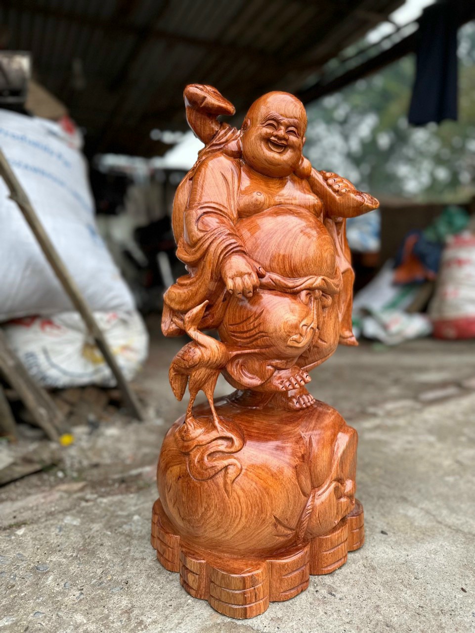 Tượng phật di lặc dắt cò bằng gỗ hương đá kt cao 60×26×24cm