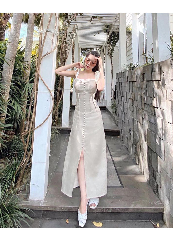 Đầm maxi nude nút bọc cột nơ vai