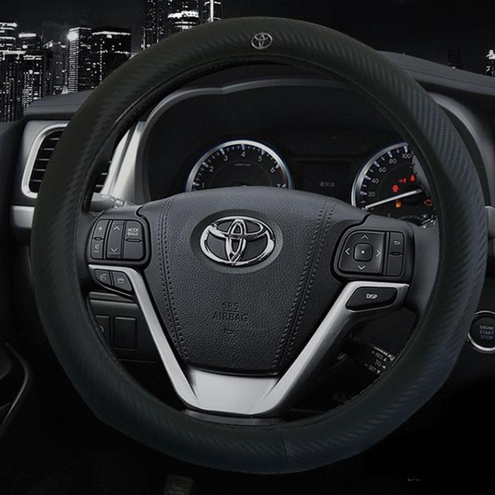 Bọc Vô Lăng Da Vân Carbon Logo Toyota - Hot