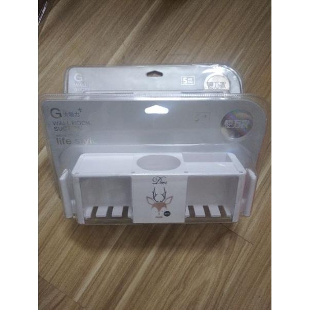 Ống đựng bàn chải đánh răng dính tường