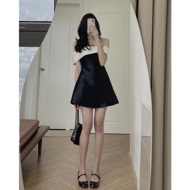 Đầm đen bẹt vai gấp trắng đính nơ lưng to