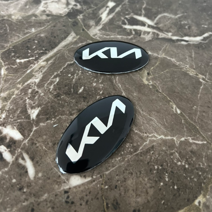 Logo biểu tượng vô lăng xe ô tô KIA, kích thước 60x30mm